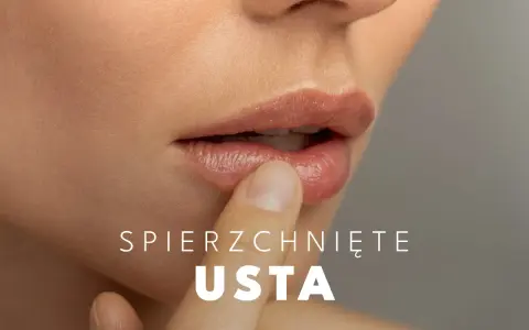 Delikatny dotyk palca na spierzchniętych ustach, szukając ulgi.